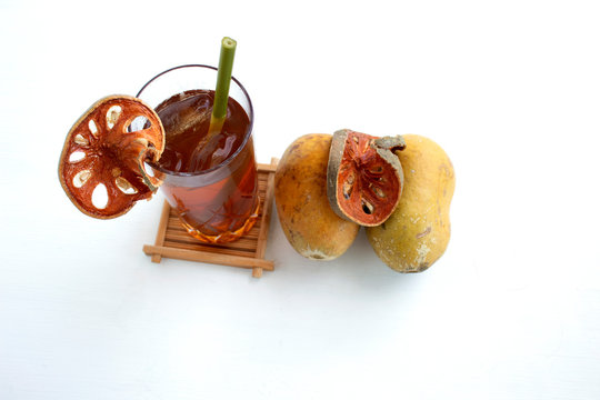 Bael fruit ice tea and slies ,tea mutum isolated on white background