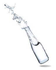 Water splashing out of glass bottle isolated on white background.