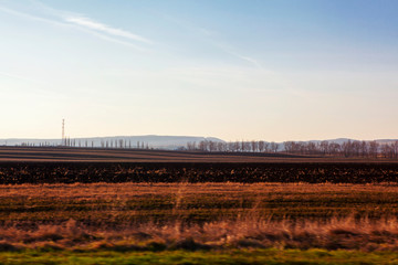 agricultural plowed field in the spring 