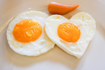 breakfast egg heart shaped on plate romantic love food and love cooking concept