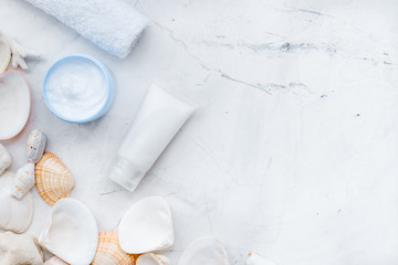 Dead Sea cosmetics with natural ingredients on stone table background top view space for text