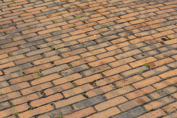 Exterior brick paving in running bond pattern, viewed on a diagonal, horizontal aspect