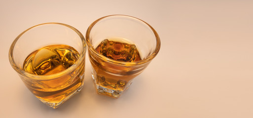 Whiskey glass with decorative lights on a white gradient background Celebration drinking concept Text entry area