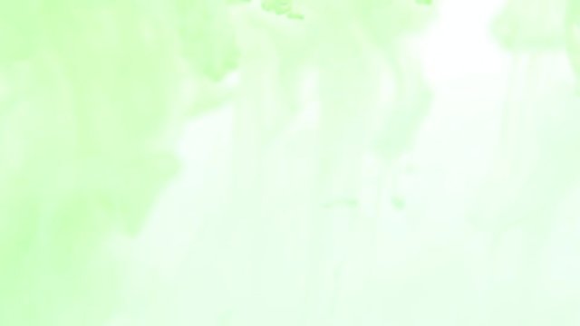 soft green color paint drops in water, abstract swirling as smoke movement background