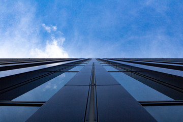 aerial view of highway with blue sky and clouds