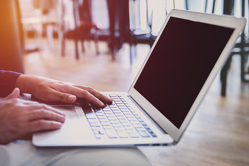 Young successful freelancer man work on his laptop.