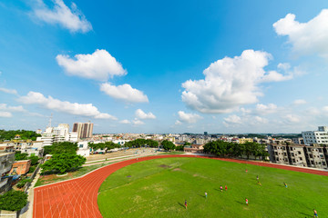 School track and field sports football fields under the blue sky white clouds