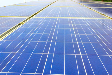 Solar power and photovoltaic panels under the blue sky white clouds.