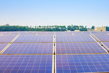 Solar power and photovoltaic panels under the blue sky white clouds.