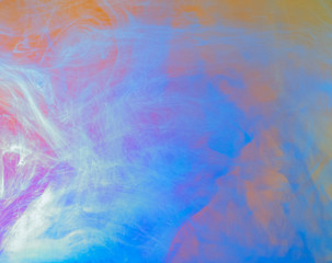 Obraz premium Multicolor abstract background, close up view. Blurred background. Abstract acrylic clouds in water. Acrylic paint dissolving into water. Ink mixing with liquid, abstract colourful pattern