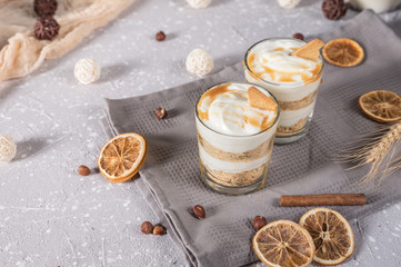 Layered mascarpone dessert with crushed vanilla biscuits and carame