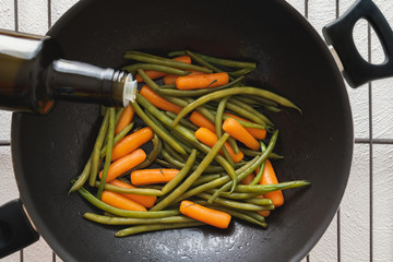 Top View of Roasted Vegetables on a Frying Pan. Green Beans and Carrots Close Up