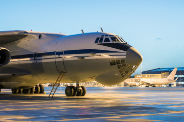 Close-up big cargo airplane at the airport apron in the early morning