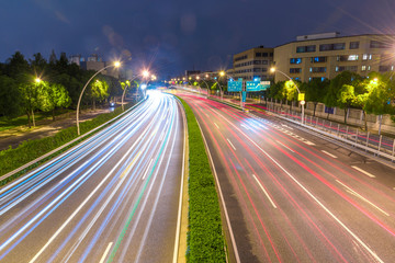 Fototapeta na wymiar The cars on the highway light trails in Shanghai, China