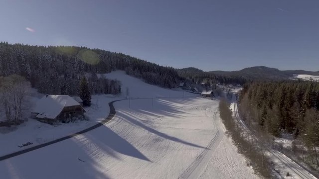 black forest landscape with snow in Germany engraved with drone aerial footage