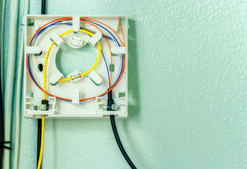 Fiber optic splicing with protection sleeve and blue fiber installed in optical terminate box for...