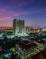 Fototapeta premium Blurred background of lights from various buildings Condominium, residence, with a variety of colorful bokeh
