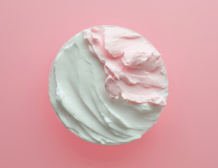 white and pink cosmetic cream