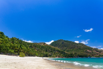 Aninuan beach, Puerto Galera, Oriental Mindoro in the Philippines, white sand, coconut trees and turquoise waters, landscape view.