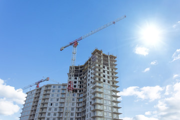 Fototapeta na wymiar Residential complex real estate, under construction areas with high cranes