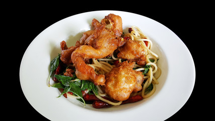 stir fried spaghetti with dried chili and soft shell crab, clipping part isolated on black background