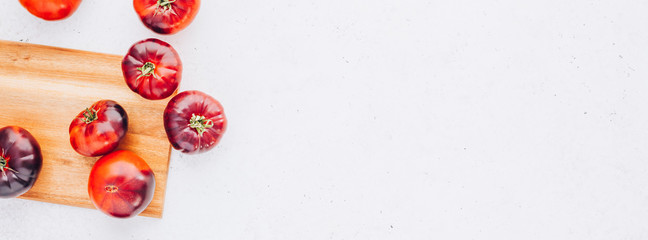 Tomatoes Mar Azul on white wooden table background