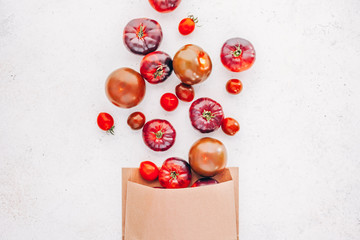 Tomatoes Mar Azul on white wooden table background