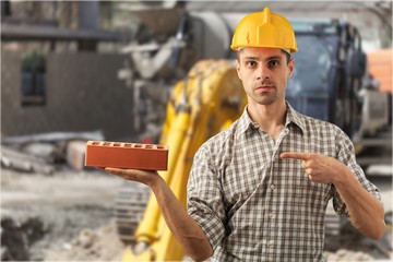 Engineer construction in yellow helmet and protective vest