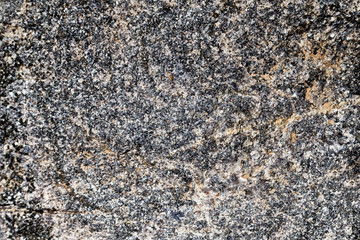 Gray granite texture. The texture of the stone.