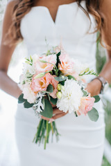 Bride in white dress holding bouquet