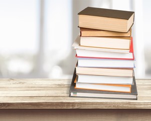 Collection of old books on wooden table