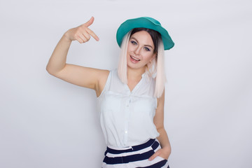 Beautiful blonde woman in green hat