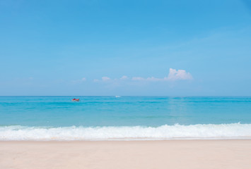 Fototapeta na wymiar Beautiful blue ocean wave and jet ski on tropical beach. Sandy beach with sea and blue sky background. Summer, holiday -Image