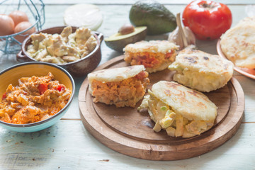 Arepas with reina pepiada and egg revueltos