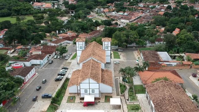 Drone footage of the downtown area of the city of Pirenopolis, Brazil, including aerial footage of a local church.