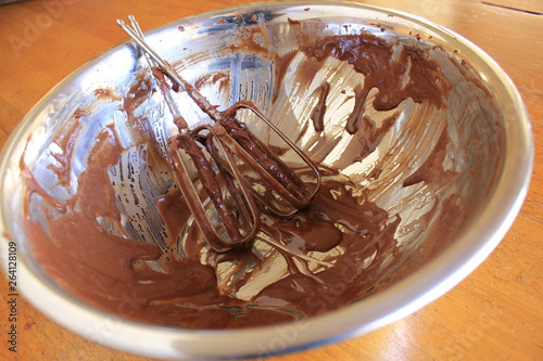 Metal mixing bowl with leftover chocolate cake mix