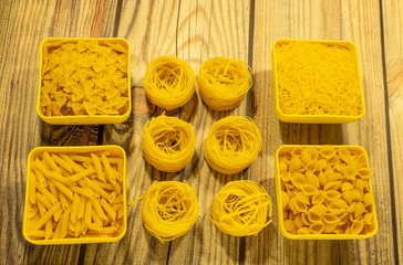 Pasta made of durum wheat on a wooden table.