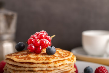 pancakes with raspberries and blueberries close up