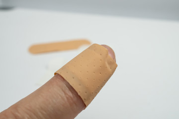 Finger with a plaster