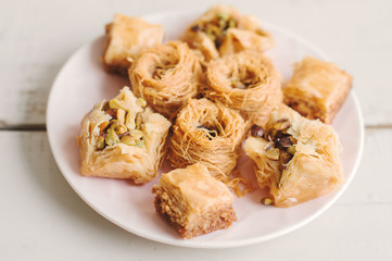 Serving of sweet arabic baklava. Traditional dessert in the Middle East with nuts and honey