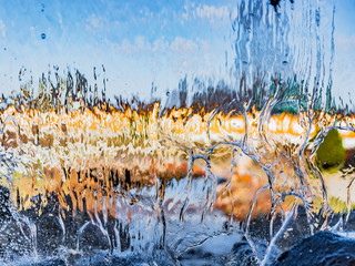 Blurred image formed by a falling wall of water. A variety of water figures in the waterfall....