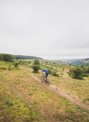 Fototapeta premium Mountain bike rider enjoying out in countryside