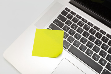 Sticky note on laptop with copy space. For all concept