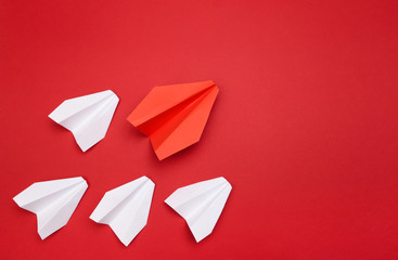 winner red  paper aircraft on red background
