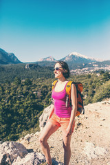 Naklejka premium Girl at the top of the mountain.