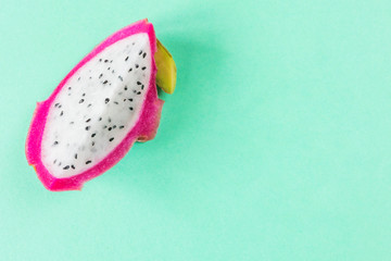 Dragon fruit or pitahaya on green. Macro photo of an exotic fruit suitable as background.