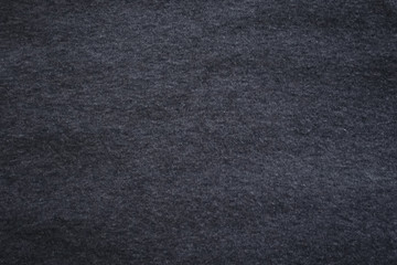 dark grey background. abstract texture of fleecy knitted fabric.