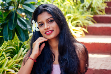 Closeup headshot portrait of attitude confident smiling happy pretty young woman background of...