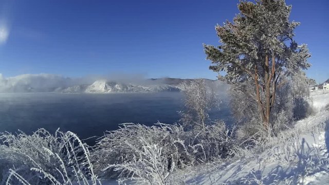 Timelapse, the movement of fog over lake Baikal. Mountains in the background