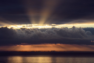 Dramatic sunrise over the  Los Angeles skyline with light rays